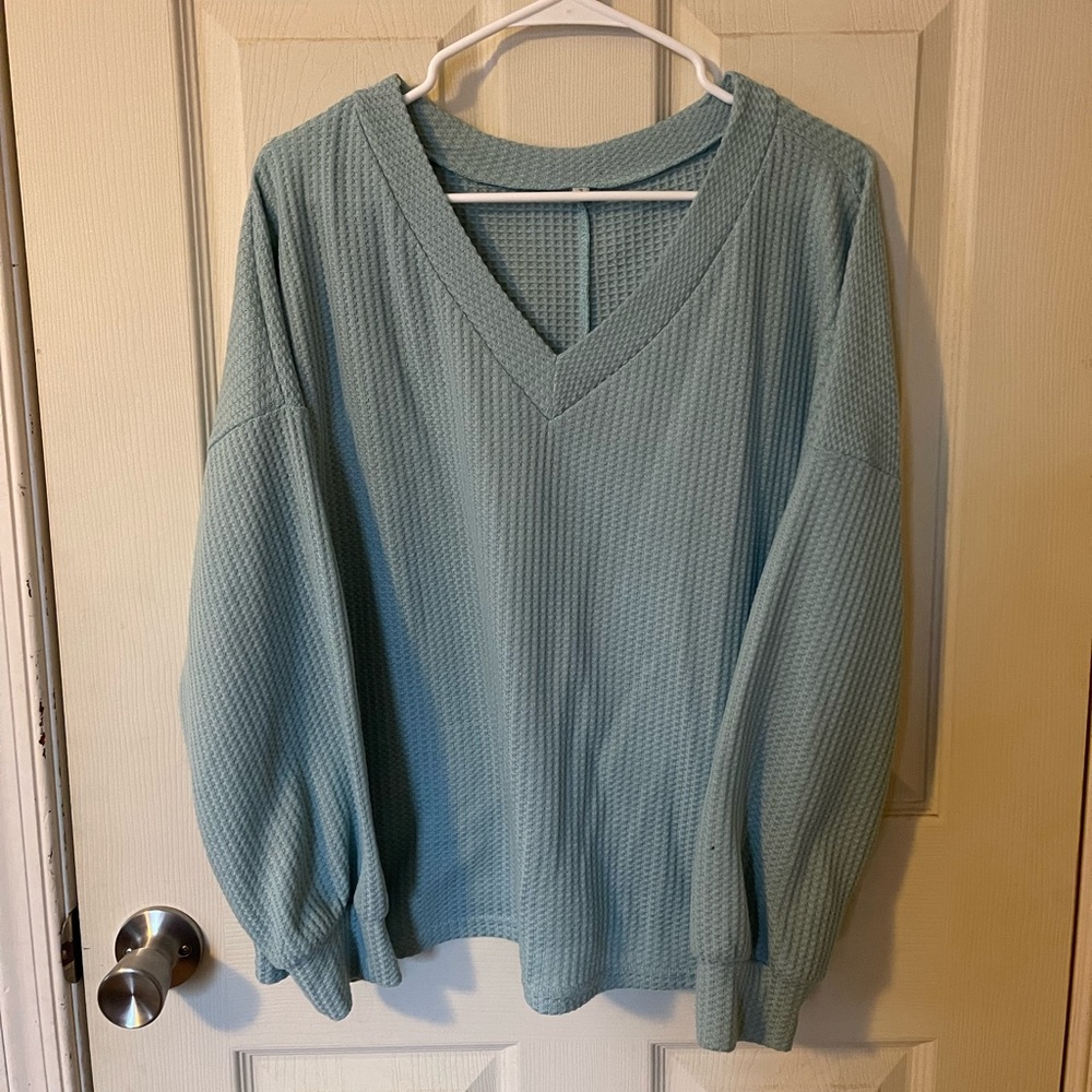 Light blue top.